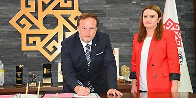 DİNÇER BAŞKANDAN ANLAMLI İMZA